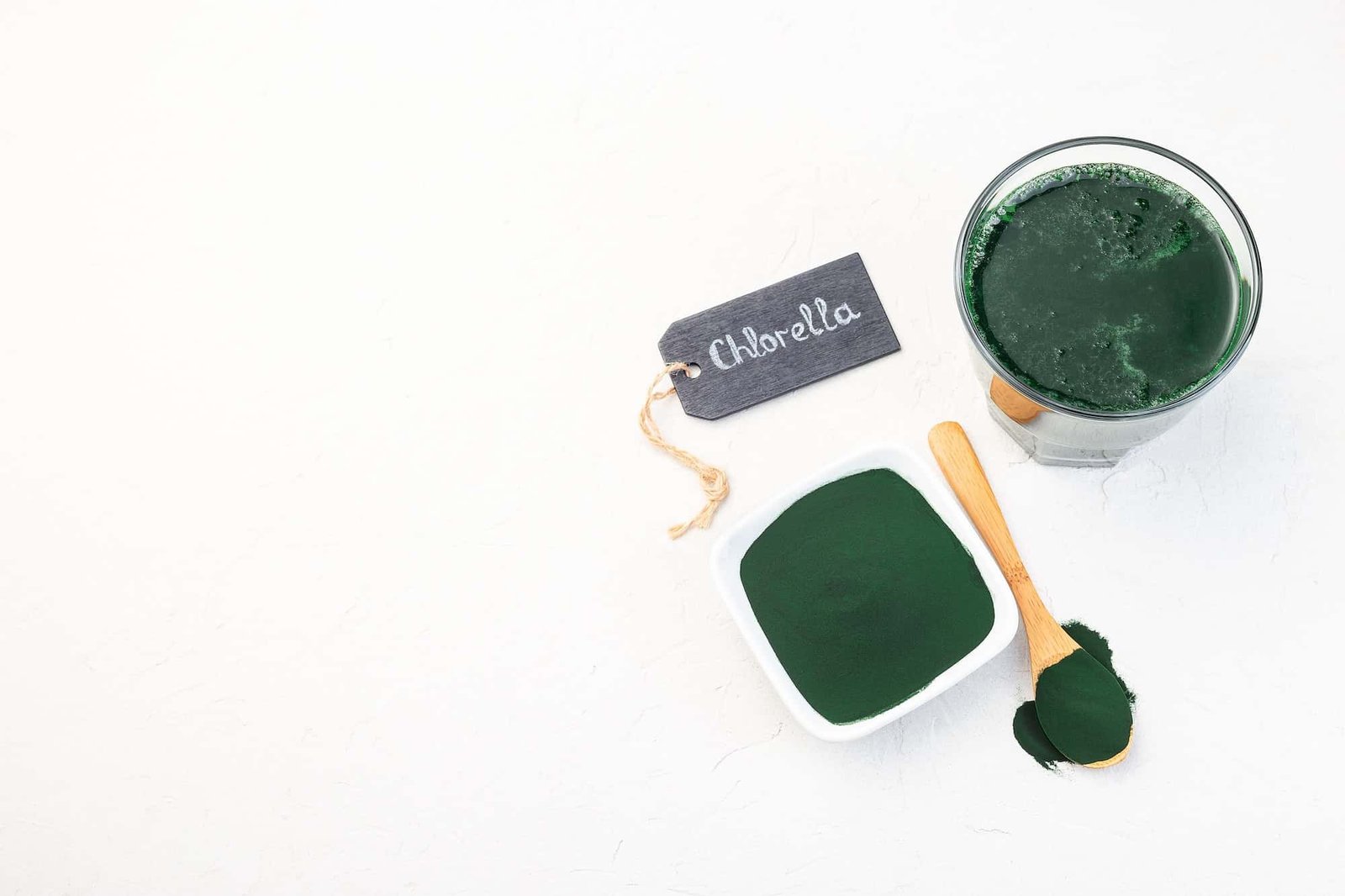Superfood chlorella in powder and as drink, horizontal, copy space, top view