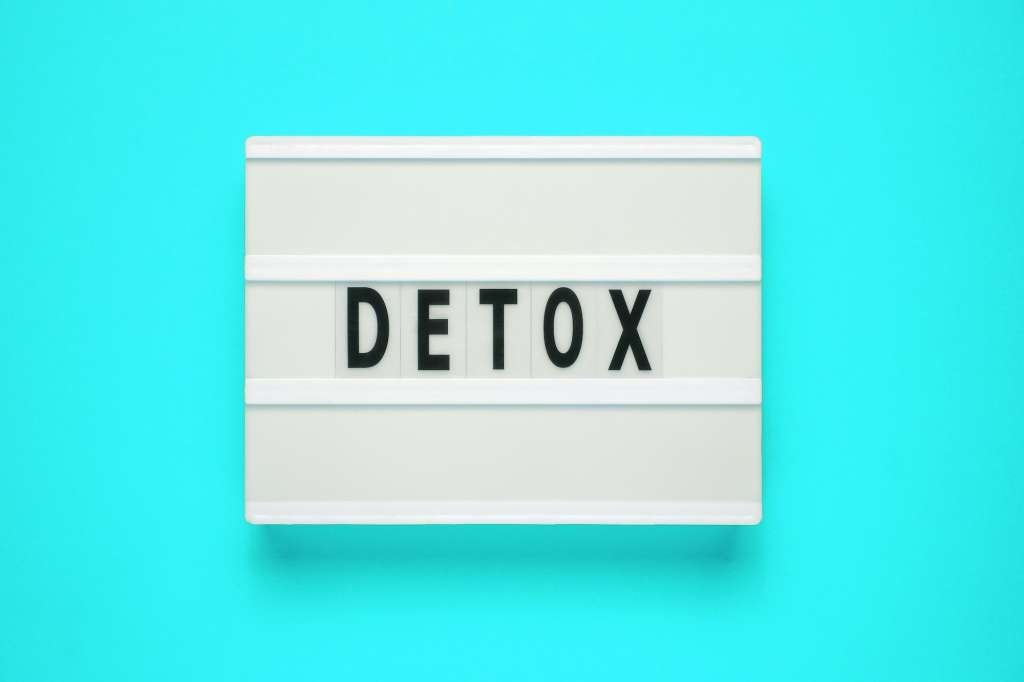 Lightbox with word detox on blue background. Healthcare concept. Digital detox as disconnected