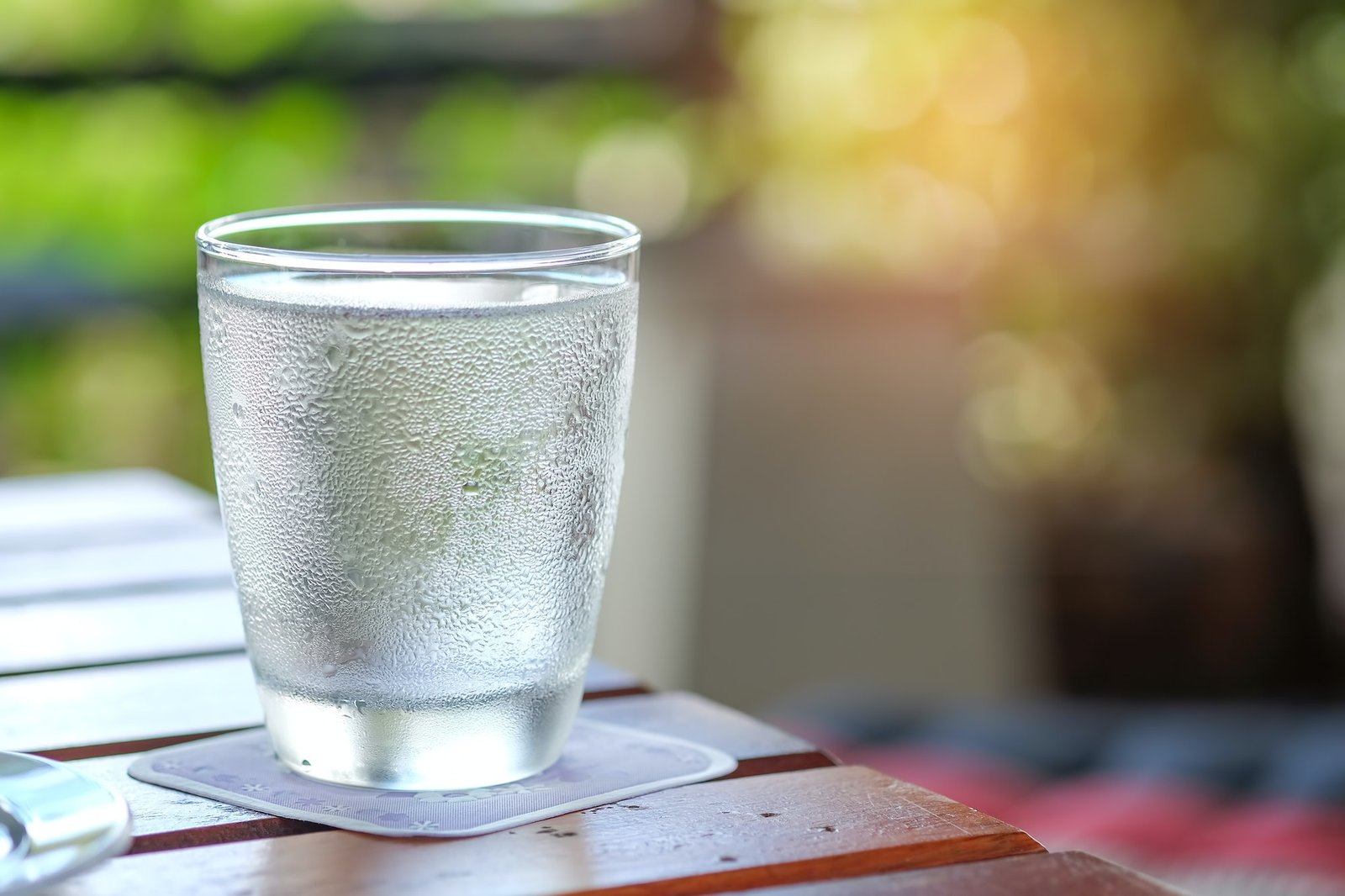 Water glass on wooden table.